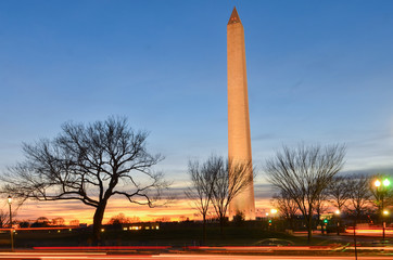 Fototapeta premium Washington Monument at night with street lights and car headlamp trails - Washington D.C. United States of America