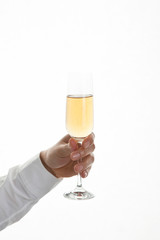 hand holding champagne glass on white background