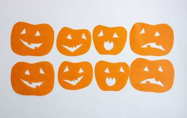 Orange funny pumpkins on a white background.The concept of Halloween