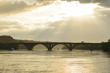 Fototapeta na wymiar Dramatic sun lights over Key Bridge - Washington D.C. United States of America