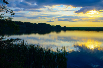 Fototapeta na wymiar Unusually beautiful sunset on the lake.