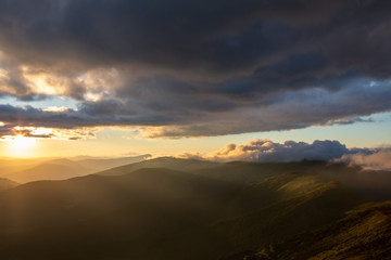 Fototapeta na wymiar view of sunset above mountains peak