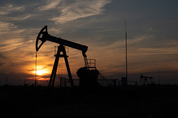 Oil Pump on orange sunset