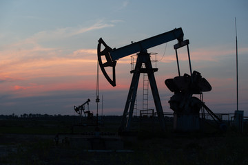 Oil Pump on orange sunset