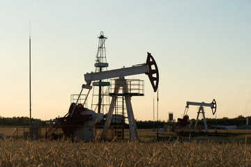Oil Pump on orange sunset