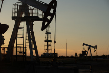 Oil Pump on orange sunset