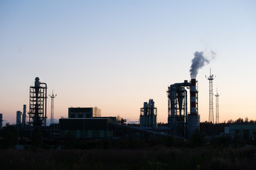 Factory pipe polluting air against sunset, environmental problems, smoke from chimneys