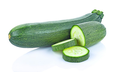 fresh green zucchini with slice isolated on white background