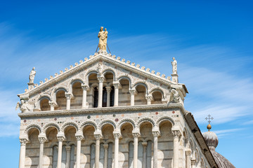 Fototapeta na wymiar Pisa Cathedral (Duomo di Santa Maria Assunta), in Pisan Romanesque style, Piazza or Campo dei Miracoli (Square of Miracles). Tuscany, Italy, Europe