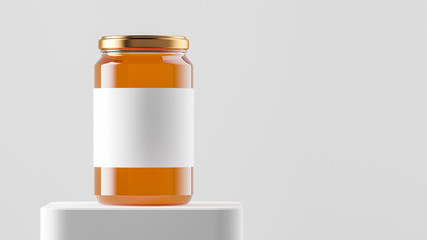 Big tall transparent glass jar with copper metal cap and blank label filled by sweet honey on the podium over white background.