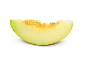 Piece of ripe melon with seeds close-up on white background