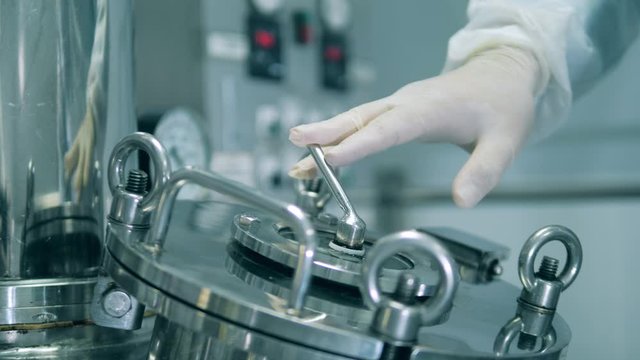 Metal handle of a bioreactor is getting turned