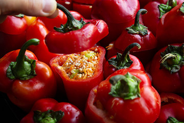 Cooking vegetarian stuffed peppers with rice, carrots and zucchini. Home cooking. Close up.