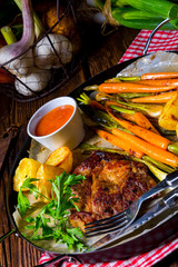 grilled neck chops with caramelized vegetables.