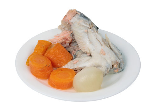 Food of the future concept - small boiiled salmon head with vegetables isolated