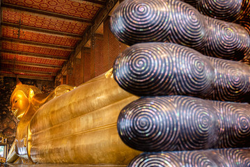 Reclining buddha statue at temple in Bangkok, Thailand