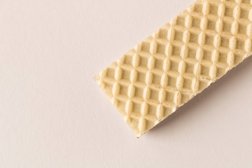 Waffle with chocolate on a light background. Selective focus.