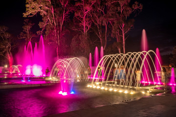 Colored musical water fountain at night. Shekvetili