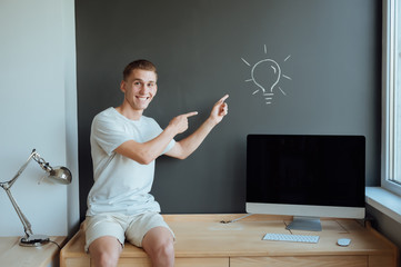 Young smiling man has an idea.Idea concept