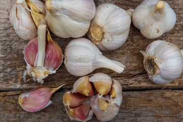 Fresh garlic on a rustic wooden table. Top view