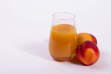a glass of peach juice