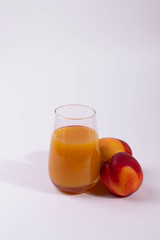 a glass of peach juice