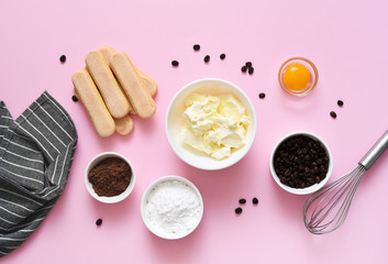 Ingredients for preparing tiramisu on a pink background. Cooking process. Classic Italian dessert.=
