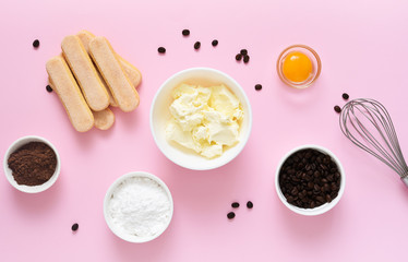 Ingredients for preparing tiramisu on a pink background. Cooking process. Classic Italian dessert.=
