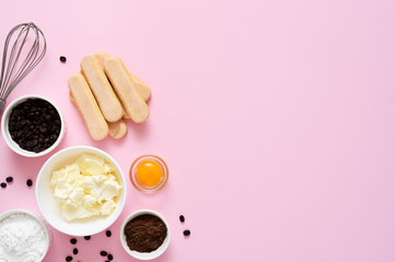 Ingredients for preparing tiramisu on a pink background. Cooking process. Classic Italian dessert.=