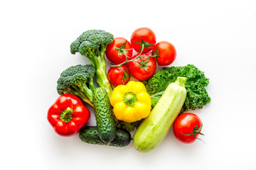 Fototapeta na wymiar A tabletop arrangement of fresh vegetables multicolored, top view