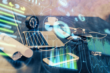 Double exposure of table with computer on background and data theme drawing. Concept of innovation.