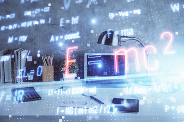 Desktop computer background and formula hologram writing. Double exposure. Education concept.