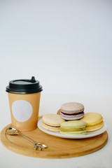 Several colorful macaroon cakes on a colored background