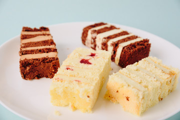 pieces of cake on white tarelke on a light background