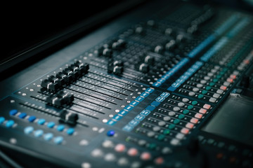 audio sound mixer controller at studio in dark background