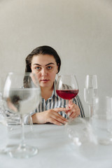 beautiful girl with glasses of water on the table