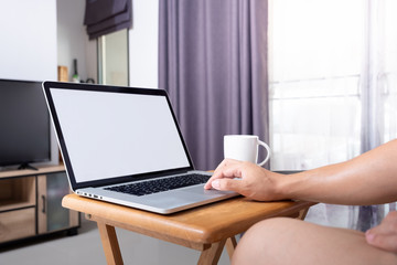 do the working  at home by using laptop on small desk in front of television  at living room in my house with evening coffee.