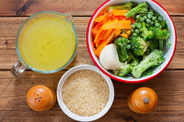 Cooking rice with frozen vegetables step by step, step 1 - preparing ingredients, top view, horizontal