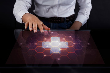 Business woman touching screen with Switzerland flag