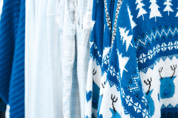 winter Christmas knitted and cotton clothing in white and blue colors. toned classic blue color trend 2020 year