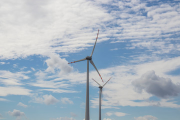 
Wind turbine on the background of the sky. Who stand in the field.