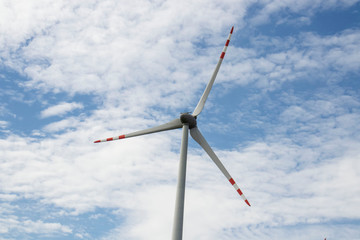 
Wind turbine on the background of the sky. Who stand in the field.