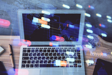 Double exposure of desktop computer and technology theme hologram. Concept of software development.