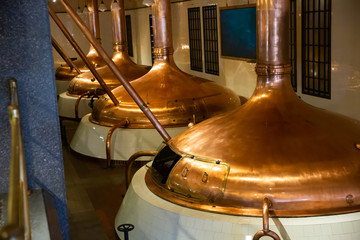 Copper beer tanks in modern brewhouse using traditional brewing technologies..