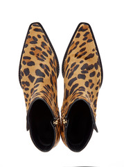 Women's half-boots made of pony fur with a leopard print with a pointed tip on the zipper. Fashionable model of demi-season shoes isolated on white background. Top view.