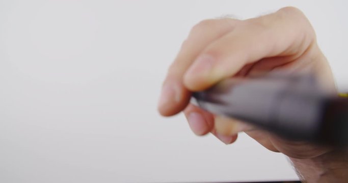 Cleaning sensor on digital camera with soft brush, first person view.