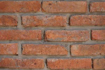 Fototapeta premium A vintage red brick wall background and texture.