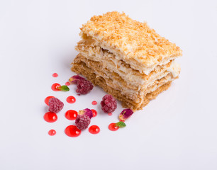 delicious cake with berries on a white background