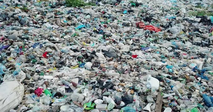 Garbage in the canals after the flood. Contaminated rivers with plastic waste.