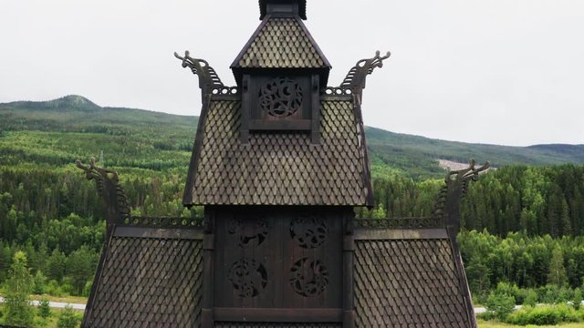 Top Roof Detail Of The Old Borgund Stave Church In Laerdal Municipality, Vestland County, Norway - close up - ascending drone shot